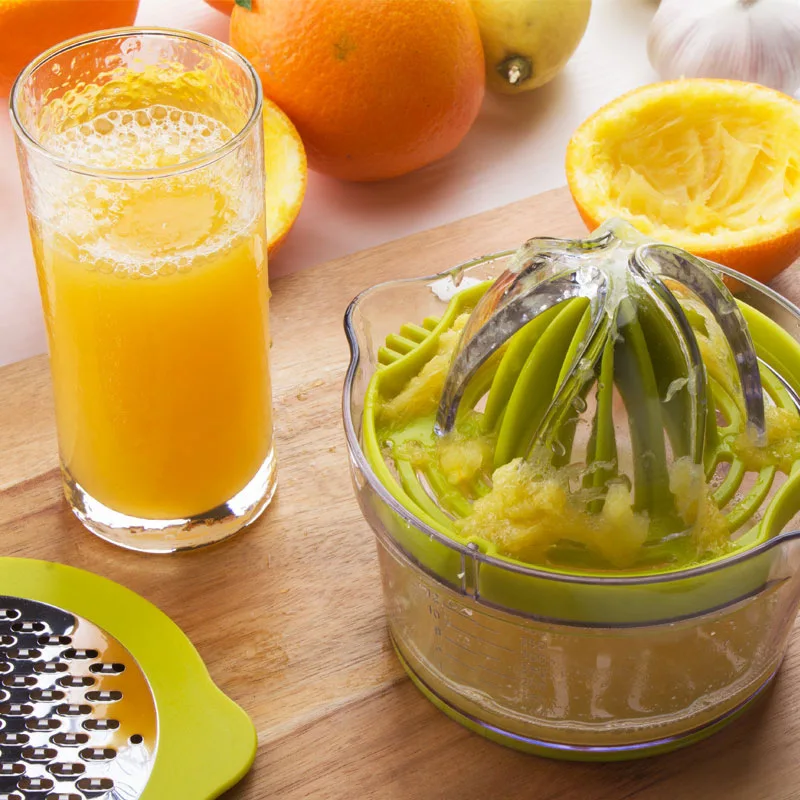 Presse-fruits manuel multifonctionnel avec tasse à mesurer intégrée